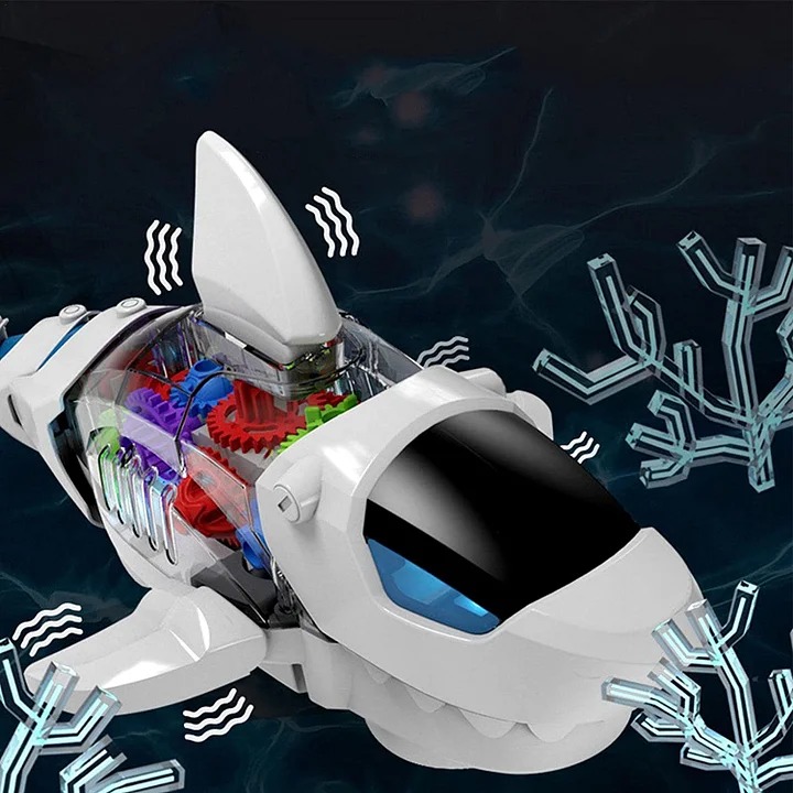 Close-up of the Electric Gear Shark's transparent housing showing red, green and purple gears meshing inside